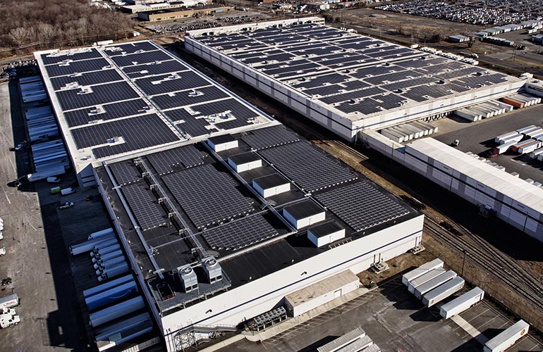 Pictured is a rooftop solar system installed at Amazon’s fulfillment warehouse in Avenel, New Jersey. The company met a goal to install solar at 50 of its distribution centers worldwide. With on-site arrays alone, Amazon has approximately 11,700 modules at its warehouses. P2 Photography