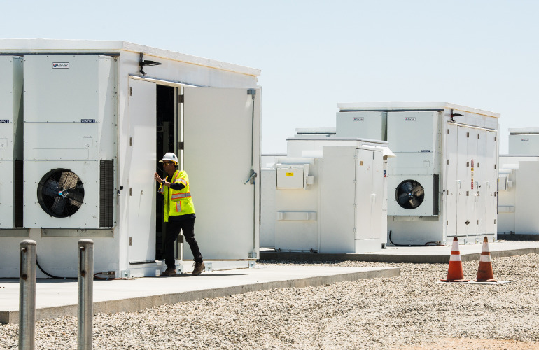 April 26 , 2018 - Members of NREL, LADWP and the 100% Renewable Energy Advisory Group get a look at the battery storage facility at the Beacon Solar Plant.  The tour was part of an overview and chance to exchange information as part of NREL's 100% Renewable Energy Study. (Photo by Dennis Schroeder / NREL)