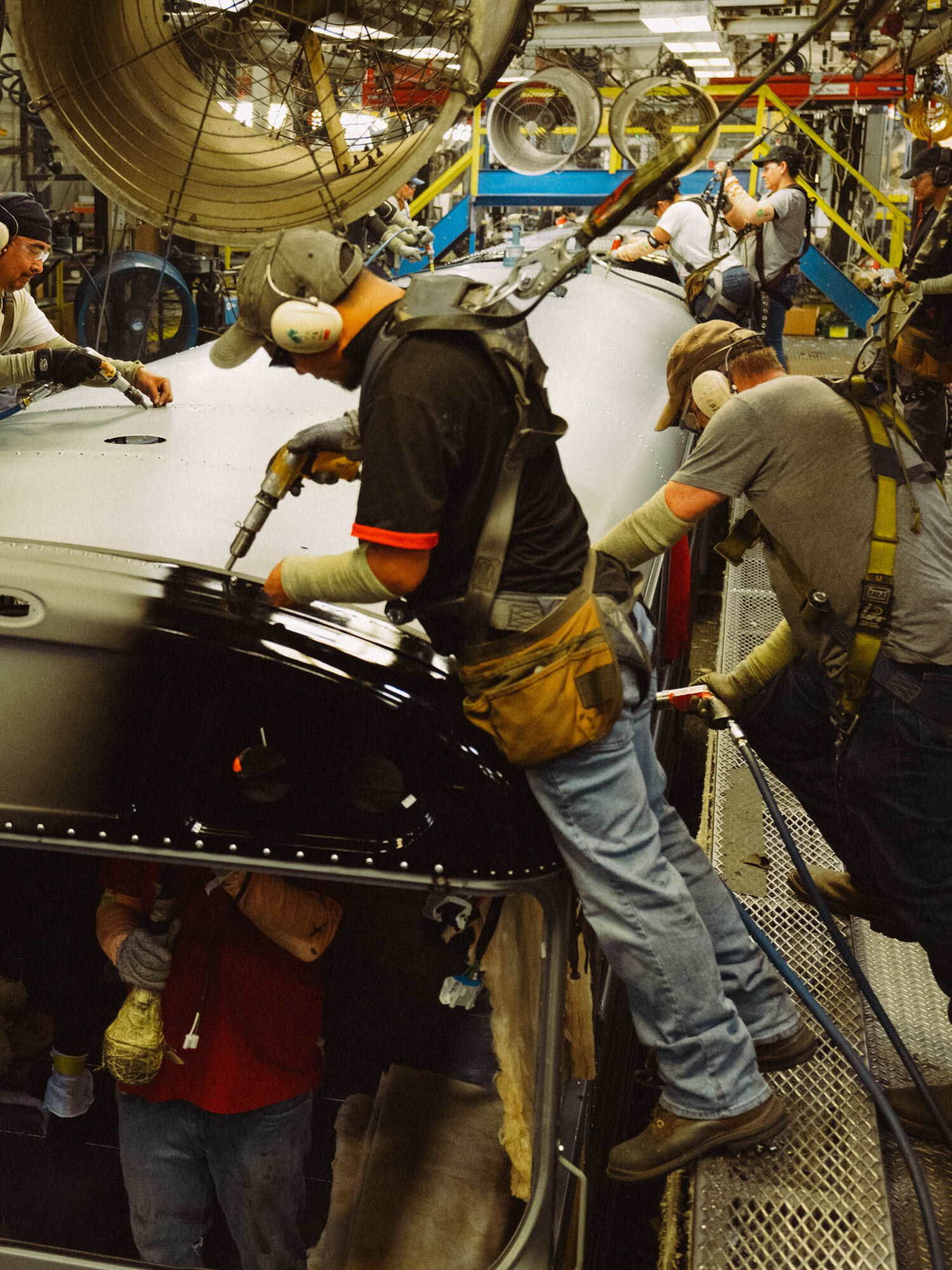 Workers riveted an electric school bus on a mile-long assembly floor in Tulsa, Oka., once known as the “Oil Capital of the World.”