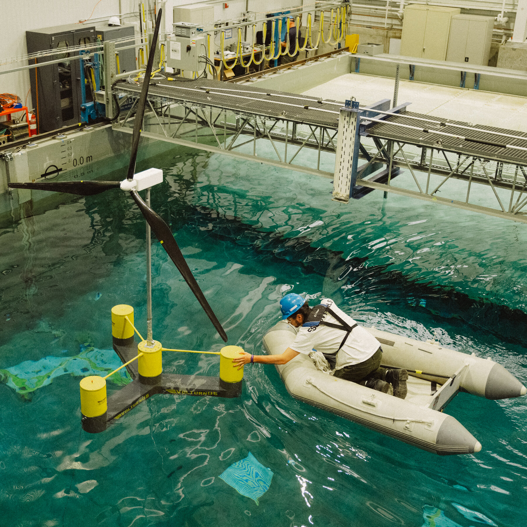 A student at the University of Maine, Connor DuPuy, worked on a prototype wind turbine in a wave pool.