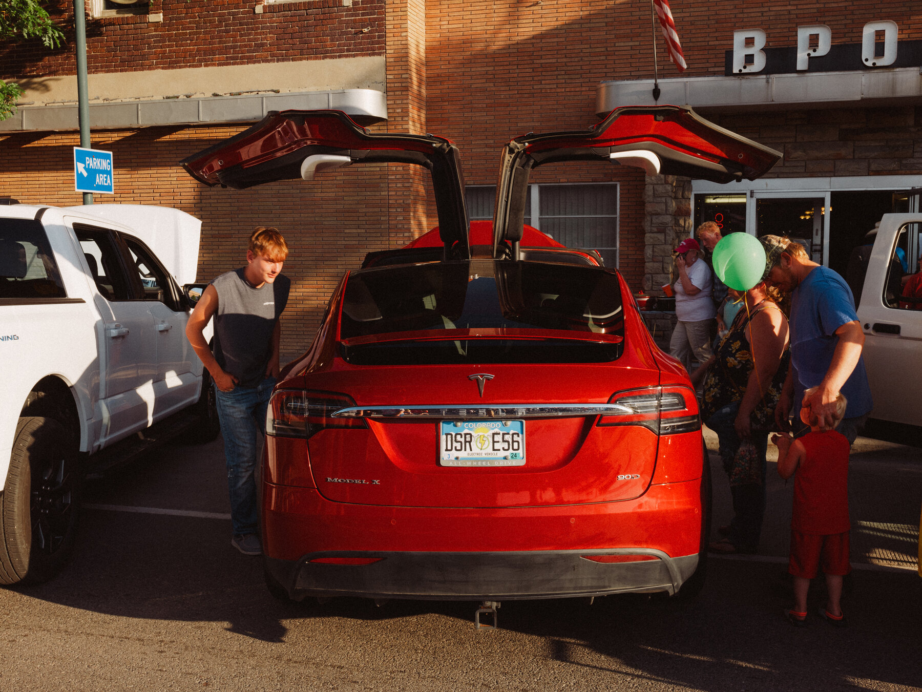 Visitors to the Rocky Mountain Rebels Car Show in Riverton, Wyo., inspected a Tesla Model X on display.