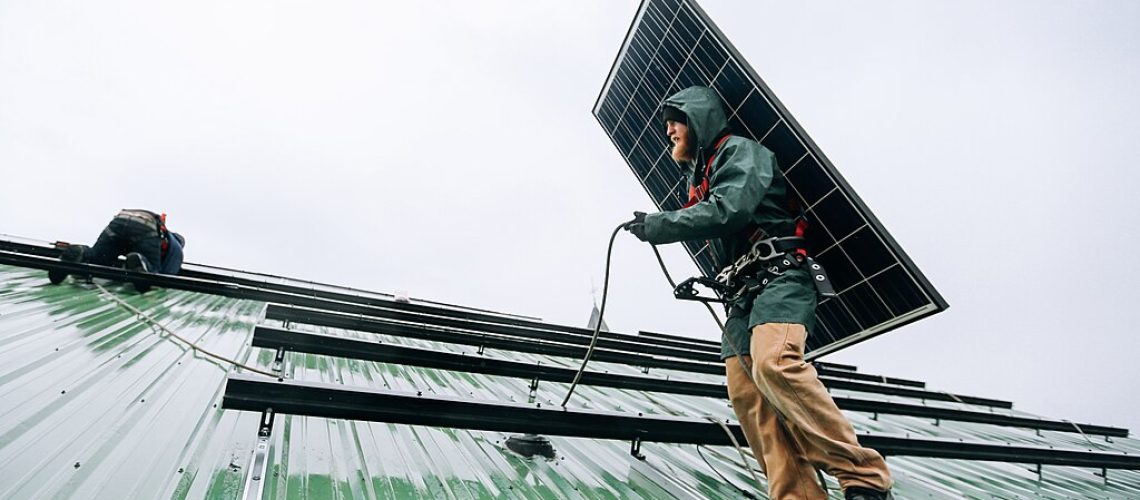 1024px-Technicians_working_on_a_solar_panel_installation_9235.jpg