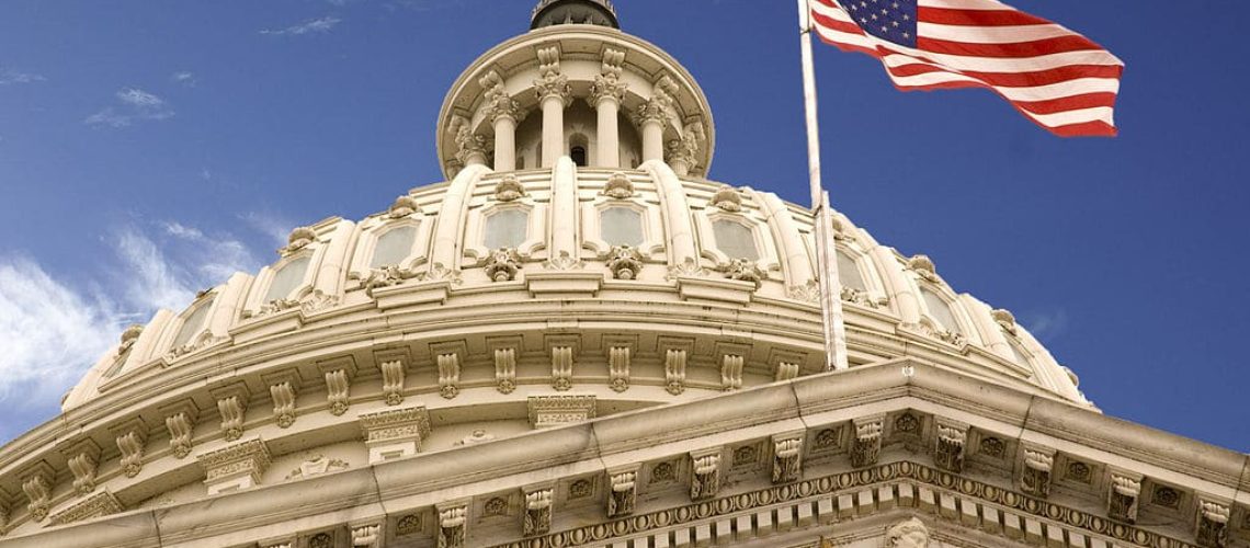 1024px-United_States_Capitol_Dome_and_Flag.jpg