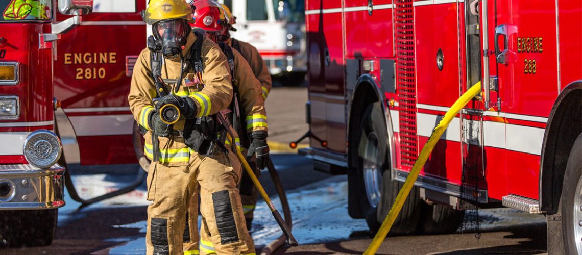 chandler-firefighter-with-hose-in-hand-1200x643.jpg