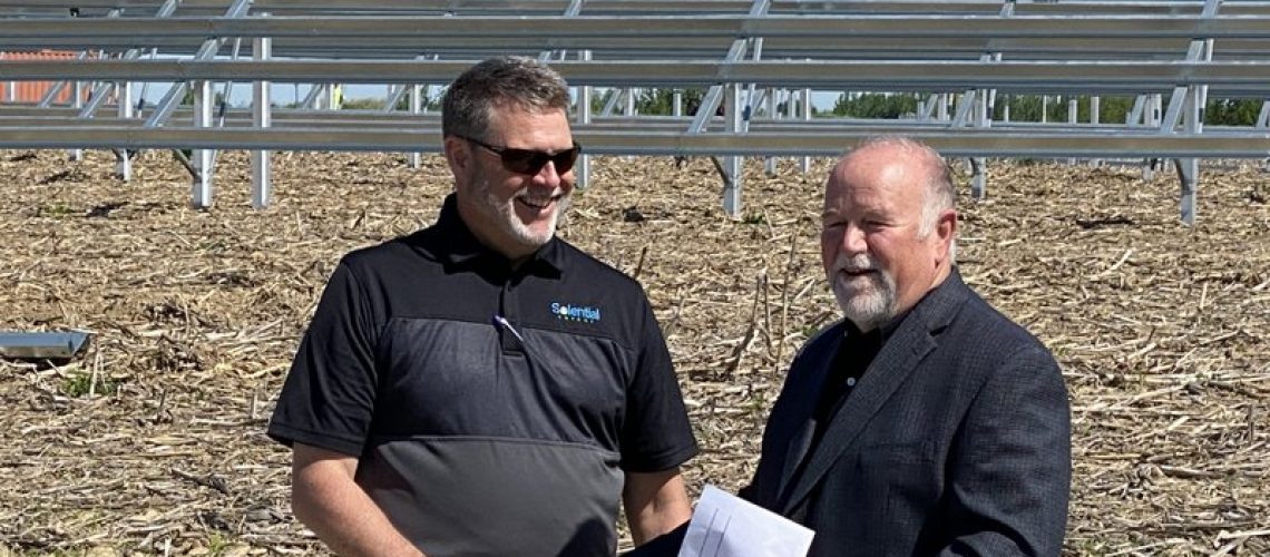 pork-producer-solar-array-handshake.jpg